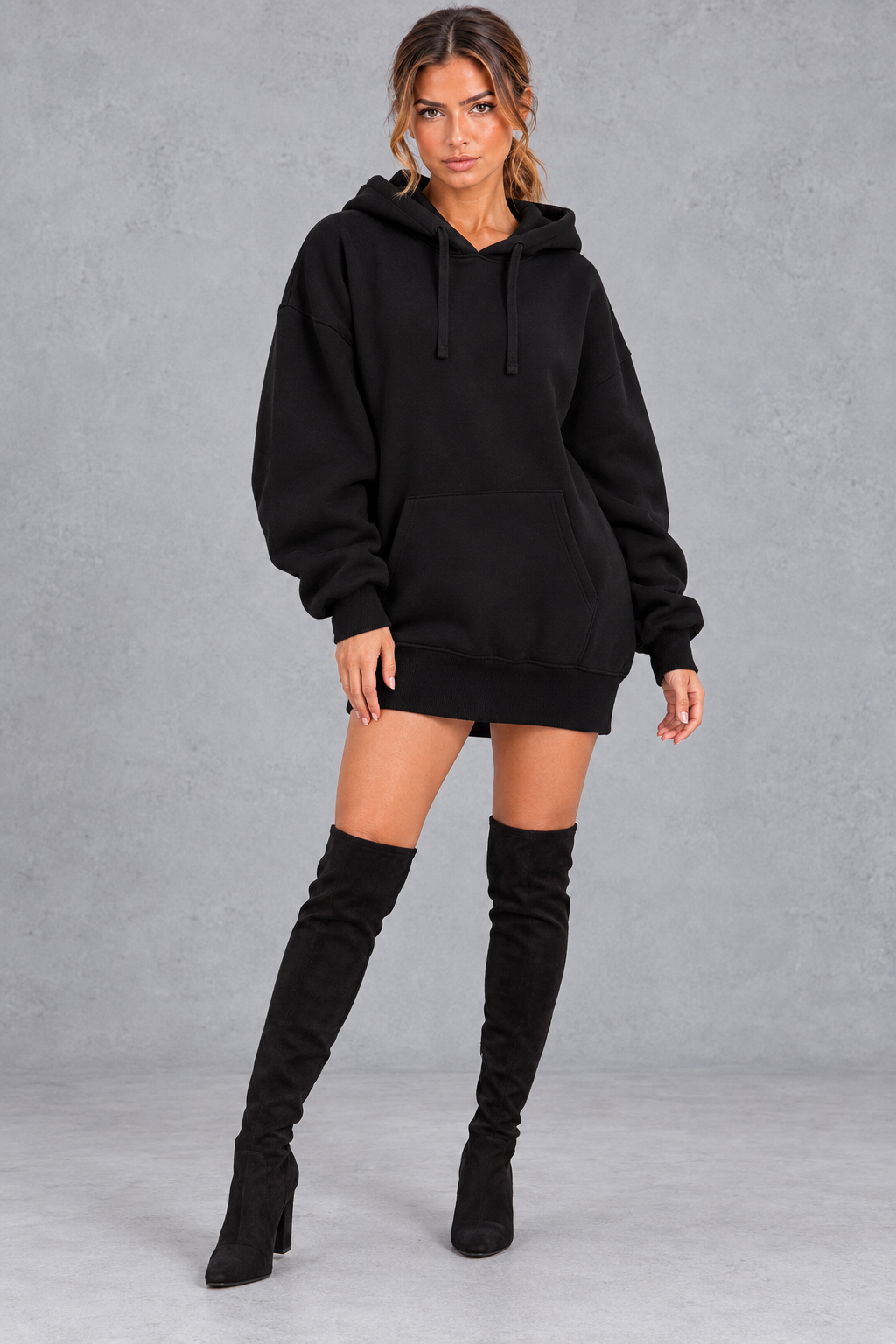 Women's black oversized hoodie mini dress with drawstring hood and kangaroo pocket – front view