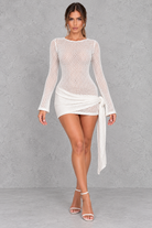 Women’s petite cream knitted mini dress with elegant pleated detailing, a textured finish and feminine silhouette.