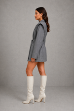 Women’s pinstripe longline blazer with structured shoulders, lapel collar and adjustable tie waist belt.