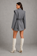 Women’s pinstripe longline blazer with structured shoulders, lapel collar and adjustable tie waist belt.