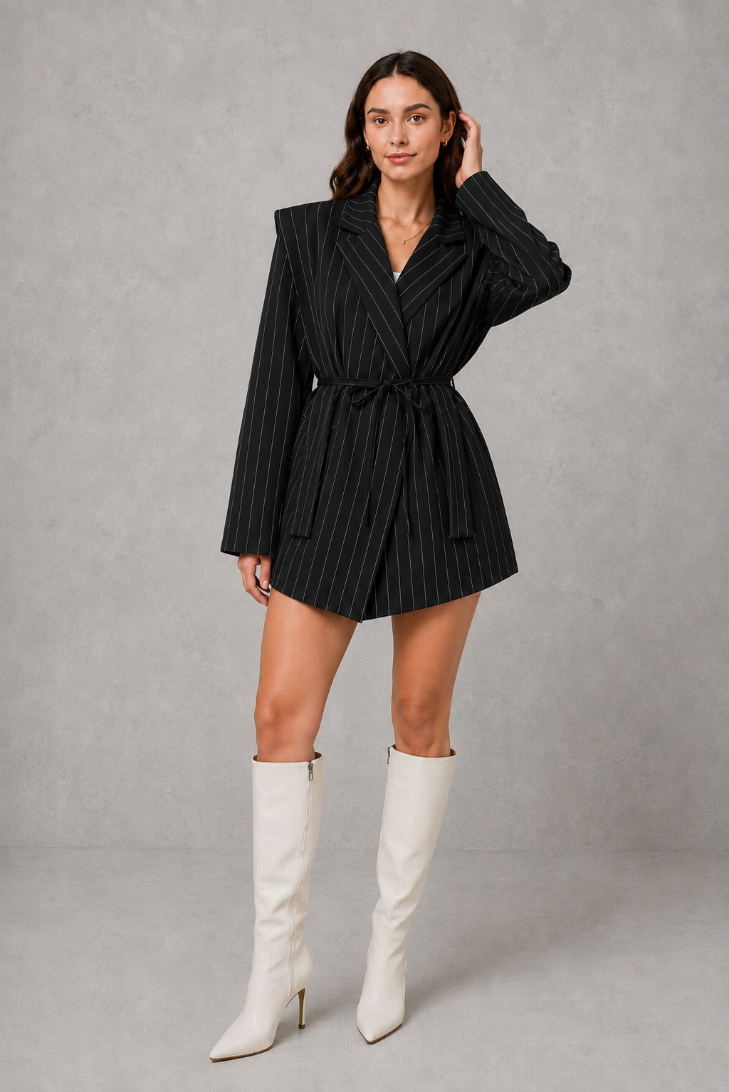 Women’s pinstripe longline blazer with structured shoulders, lapel collar and adjustable tie waist belt.