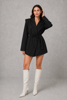 Women’s pinstripe longline blazer with structured shoulders, lapel collar and adjustable tie waist belt.