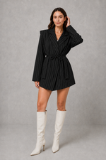 Women’s pinstripe longline blazer with structured shoulders, lapel collar and adjustable tie waist belt.