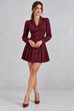 Women’s pleated shirt mini dress with long sleeves, a defined waist and tailored-inspired A-line silhouette.