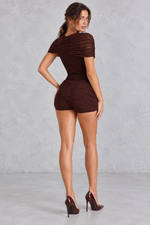 Women’s plum brown micro shorts with a mid-rise waist, asymmetric mesh drape panels and a sleek fitted silhouette.