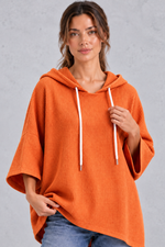 Women's plus size orange waffle knit hoodie – close-up of drawstring hood and waffle texture