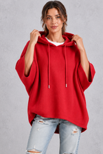 Women's plus size red waffle knit oversized hoodie with drawstring hood and wide sleeves – front view