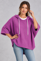 Women's plus size purple waffle knit oversized hoodie with drawstring hood and wide sleeves – front view