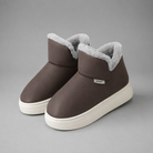 Women's knee-high winter boots with a smooth PU upper, soft plush lining, slip-on design, lightweight wedge heel and non-slip rubber sole, providing warm, comfortable everyday wear for autumn and winter.
