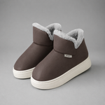 Women's knee-high winter boots with a smooth PU upper, soft plush lining, slip-on design, lightweight wedge heel and non-slip rubber sole, providing warm, comfortable everyday wear for autumn and winter.