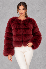 Women’s plush cropped faux fur winter jacket with a rounded neckline, long sleeves and a soft voluminous silhouette.
