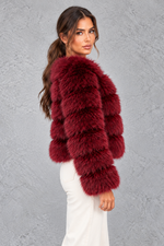 Women’s plush cropped faux fur winter jacket with a rounded neckline, long sleeves and a soft voluminous silhouette.