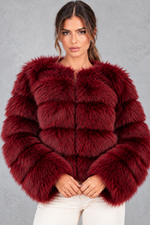 Women’s plush cropped faux fur winter jacket with a rounded neckline, long sleeves and a soft voluminous silhouette.