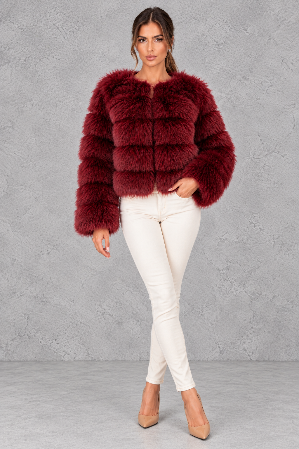 Women’s plush cropped faux fur winter jacket with a rounded neckline, long sleeves and a soft voluminous silhouette.