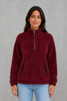 Women’s plush half zip fleece pullover with a high neck, long sleeves, elasticated cuffs and practical front pockets for cosy autumn and winter wear.