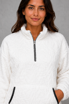 Women’s plush half zip fleece pullover with a high neck, long sleeves, elasticated cuffs and practical front pockets for cosy autumn and winter wear.