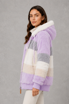 Women’s plush hooded winter coat with soft faux fur panels, a relaxed silhouette and rib-knit cuffs for cosy cold-weather layering.