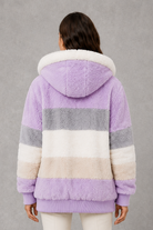 Women’s plush hooded winter coat with soft faux fur panels, a relaxed silhouette and rib-knit cuffs for cosy cold-weather layering.