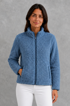 Women’s plush sherpa jacket with a soft textured finish, relaxed flattering silhouette and cosy construction for everyday cold-weather layering.