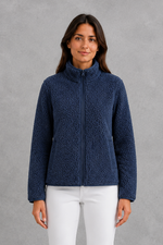 Women’s plush sherpa jacket with a soft textured finish, relaxed flattering silhouette and cosy construction for everyday cold-weather layering.