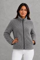 Women’s plush sherpa jacket with a soft textured finish, relaxed flattering silhouette and cosy construction for everyday cold-weather layering.