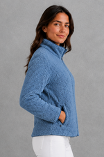 Women’s plush sherpa jacket with a soft textured finish, relaxed flattering silhouette and cosy construction for everyday cold-weather layering.