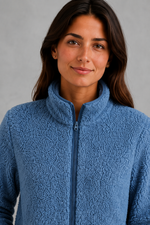 Women’s plush sherpa jacket with a soft textured finish, relaxed flattering silhouette and cosy construction for everyday cold-weather layering.