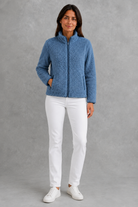 Women’s plush sherpa jacket with a soft textured finish, relaxed flattering silhouette and cosy construction for everyday cold-weather layering.