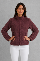 Women’s plush sherpa jacket with a soft textured finish, relaxed flattering silhouette and cosy construction for everyday cold-weather layering.