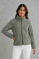 Women’s plush sherpa jacket with a soft textured finish, relaxed flattering silhouette and cosy construction for everyday cold-weather layering.