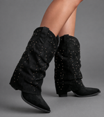 Women’s pointed toe knee high boots with a low chunky heel and relaxed Western-inspired shaft in a neutral shade.