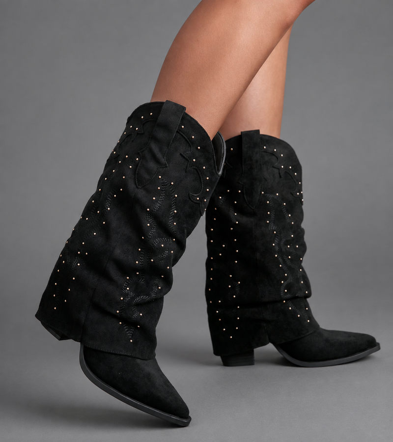 Women’s pointed toe knee high boots with a low chunky heel and relaxed Western-inspired shaft in a neutral shade.