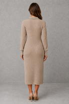 Women’s polo neck knitted midi dress with a button-front neckline, long sleeves, ribbed cuffs and a relaxed straight silhouette.