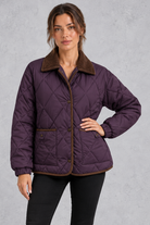 Women's deep purple diamond quilted jacket with brown cord collar and trim – front view