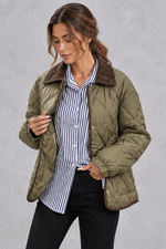 Women's green diamond quilted jacket with contrast cord collar – front view