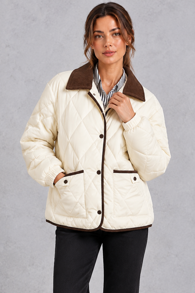 Women's cream diamond quilted jacket with brown cord collar and trim – front view
