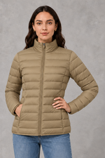 Women’s quilted puffer jacket with horizontal padding, high stand collar, zip-front fastening and a lightweight streamlined silhouette.