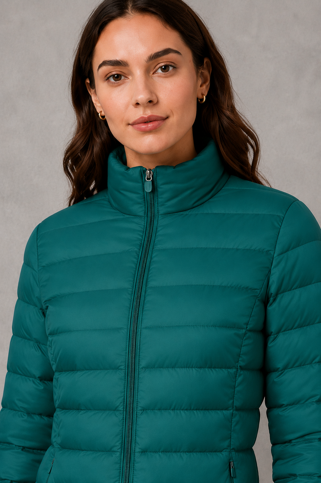 Women’s quilted puffer jacket with horizontal padding, high stand collar, zip-front fastening and a lightweight streamlined silhouette.