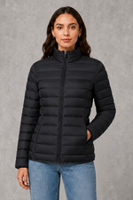 Women’s quilted puffer jacket with horizontal padding, high stand collar, zip-front fastening and a lightweight streamlined silhouette.