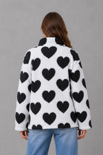 Women’s reversible lightweight jacket with a heart-inspired pattern, soft-touch finish and flattering casual silhouette for everyday layering.
