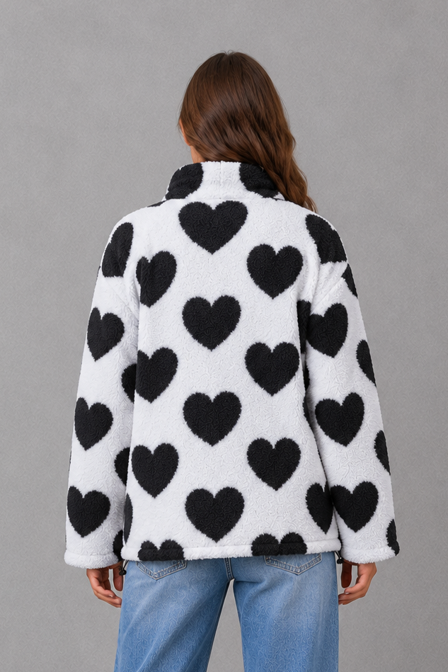 Women’s reversible lightweight jacket with a heart-inspired pattern, soft-touch finish and flattering casual silhouette for everyday layering.