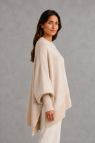 Women’s ribbed high neck knit jumper with long sleeves and a relaxed, softly draped silhouette for autumn and winter wear.