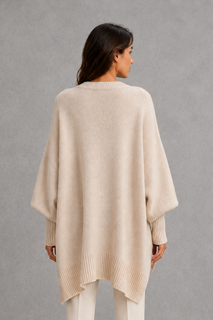 Women’s ribbed high neck knit jumper with long sleeves and a relaxed, softly draped silhouette for autumn and winter wear.