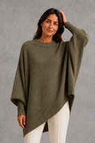 Women’s ribbed high neck knit jumper with long sleeves and a relaxed, softly draped silhouette for autumn and winter wear.