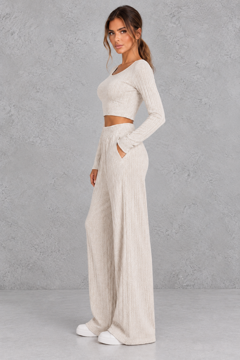 Women’s ribbed knit two-piece set with a fitted long-sleeve cropped top, scoop neckline and matching wide leg trousers.