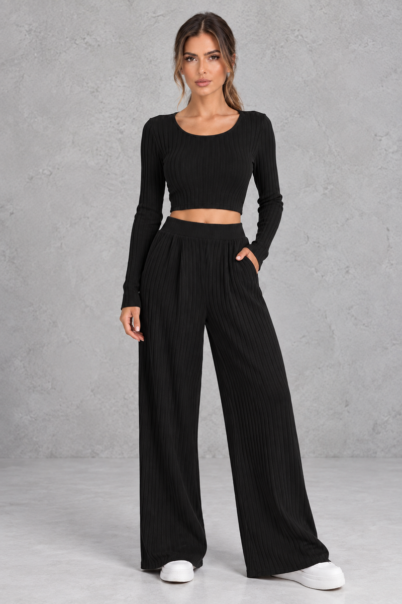 Women’s ribbed knit two-piece set with a fitted long-sleeve cropped top, scoop neckline and matching wide leg trousers.
