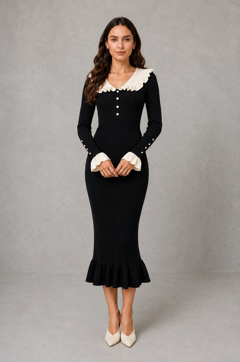 Women’s ribbed knit midi dress with a statement ruffle collar, decorative front buttons, fitted silhouette, long sleeves and flared ruffle cuffs.