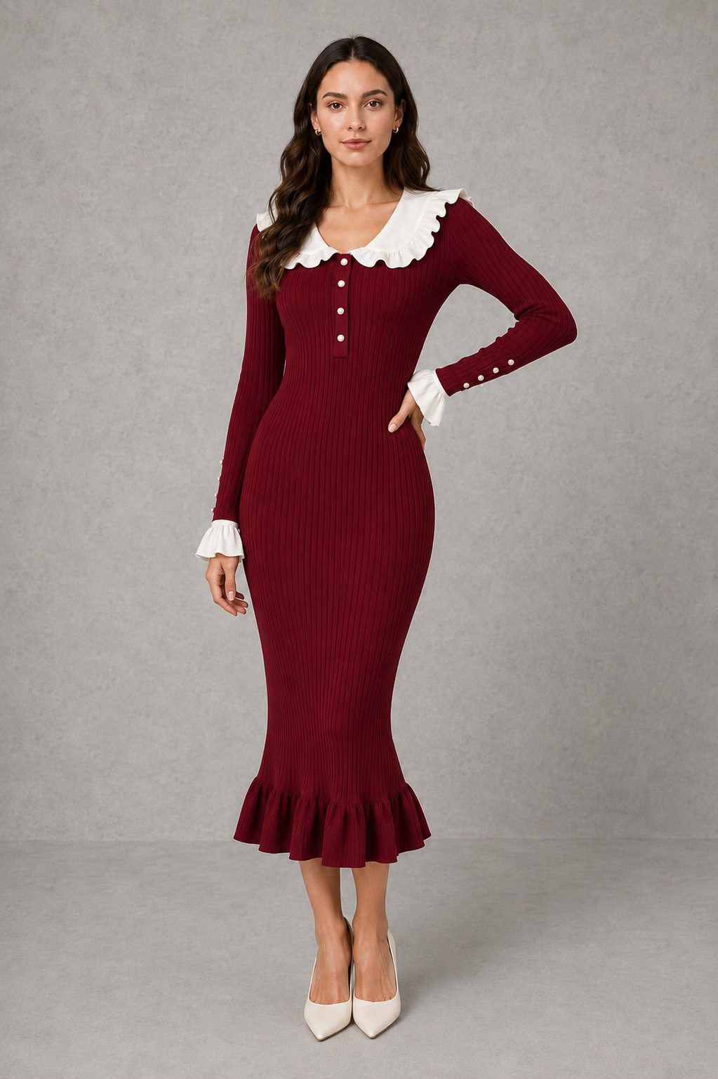 Women’s ribbed knit midi dress with a statement ruffle collar, decorative front buttons, fitted silhouette, long sleeves and flared ruffle cuffs.