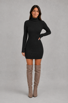 Women’s ribbed roll neck mini dress with a fitted silhouette, vertical rib-knit texture and long sleeves for elegant autumn and winter styling.