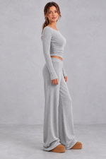 Women's grey ribbed knit co-ord set with long sleeve crop top and wide leg trousers – side view
